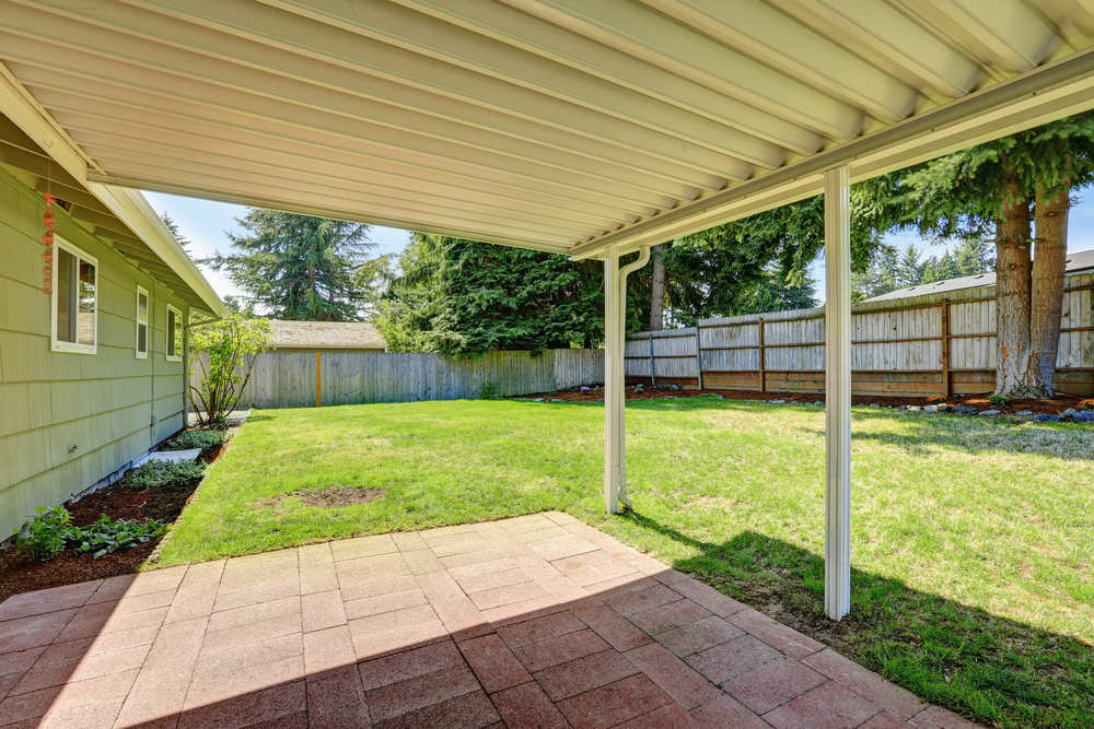 Covered,Backyard,Patio,With,Brick,Tile,Floor.