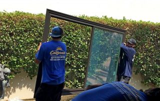 Men Carrying Black Windows