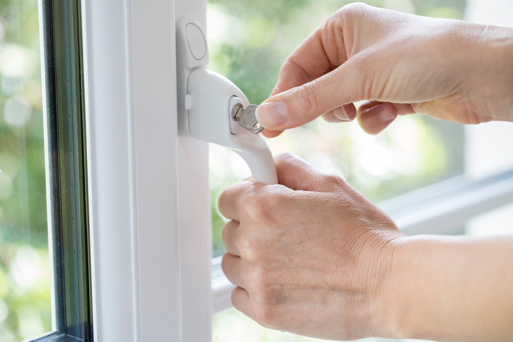 Person locking window - ENHANCING HOME SAFETY WITH WINDOW REPLACEMENT